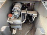a machine that is sitting in the back of a boat
