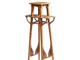 a tall wooden stool with a shelf on top of it