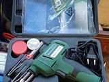 a box with tools in it sitting on the floor