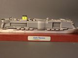 a model of a cruise ship on display on a shelf