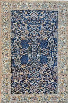a blue rug with a floral design on it