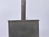 a small metal stove sitting on top of a table