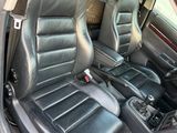 the interior of a car with black leather seats and a steering wheel