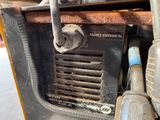 a close up of a machine that is sitting on the ground