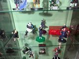 many figurines on display in a glass case