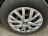 the tire of a car with a flat tire on the ground