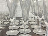 a lot of wine glasses sitting on a table