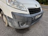 a white van that is parked on the side of the road