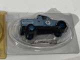 a small toy truck in a plastic package