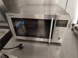 a microwave that is sitting on a counter in a kitchen