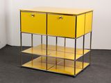 a yellow shelf with two drawers on top of it