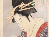 an image of a woman reading a book with chopsticks in her hair