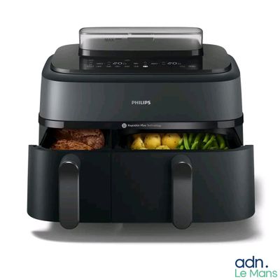 philips air fryer with vegetables and meat in it on a white background
