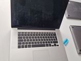 a laptop computer sitting on top of a white desk