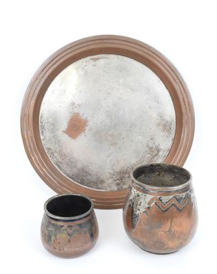 three different types of pottery sitting on a white surface