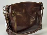 an image of a brown leather purse on a white background