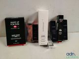 many different types of makeup products on the counter