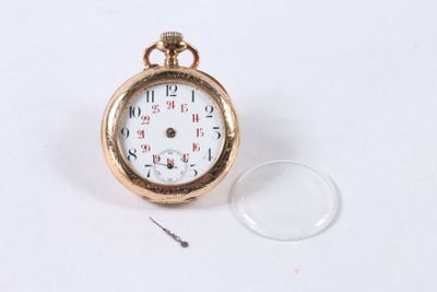 a gold pocket watch with a white face on a white surface