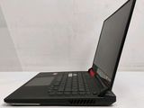 a laptop computer sitting on top of a white table next to a white wall