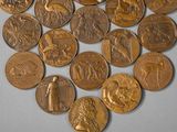 a lot of coins that are laying on a table
