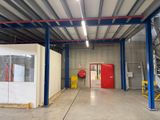 a large room with a red door in it