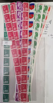 a lot of stamps on the table with a lot of notes