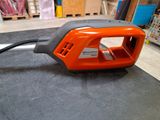 an orange and black blow dryer sitting on a table