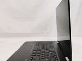 a black laptop with a black keyboard on a white surface