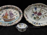 two plates and a cup on a black table