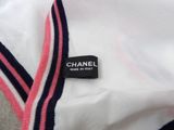 a white shirt with a pink and black stripe on it