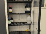 a refrigerator that has a lot of bottles and containers in it