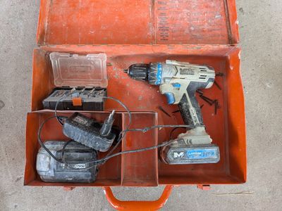 a tool box with tools in it sitting on the floor
