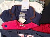 a lot of clothes that are on a table