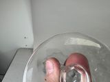 a person holding a glass of water in their hand
