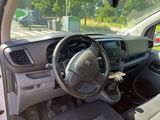 a dashboard and steering wheel of a car on the street
