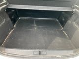 a trunk of a car with the back seats folded down