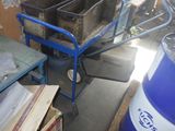 an image of a room with a cart full of items