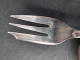a fork that has been placed on a table