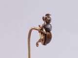 an image of a bronze figurine of a cat sitting on a ball