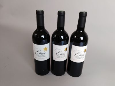 trois bouteilles de vin posées sur une table blanche