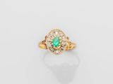 an emerald and diamond ring