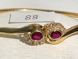 gold plated bang bracelet with pink stones and white stones