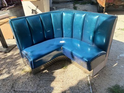 a blue couch that is sitting on the ground