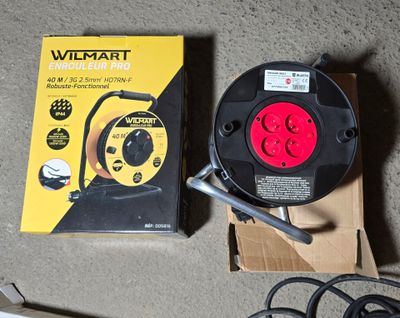 a box of wires and a hose sitting on the floor