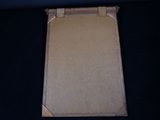 an empty piece of cardboard sitting on top of a black table