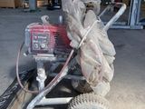 a small machine that is sitting in a garage
