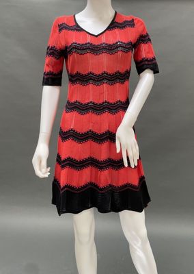 a red and black dress on a mannequin mannequin mannequin mannequin mannequin mannequin mannequin mannequin mann