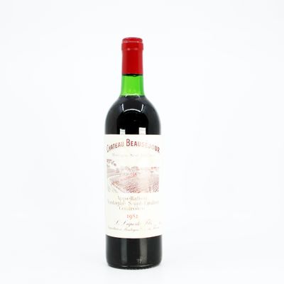 a bottle of wine that is sitting on a table