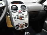 a car dashboard with a steering wheel and a clock on it