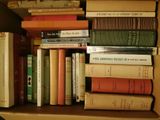 many books that are sitting in a box together